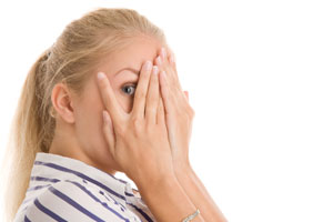 Photo: Girl covering eyes // Shutterstock