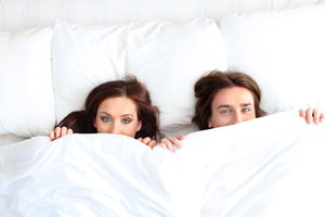 Photo: Couple in bed // Shutterstock