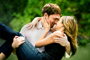 Photo: Guy carrying girl // iStock
