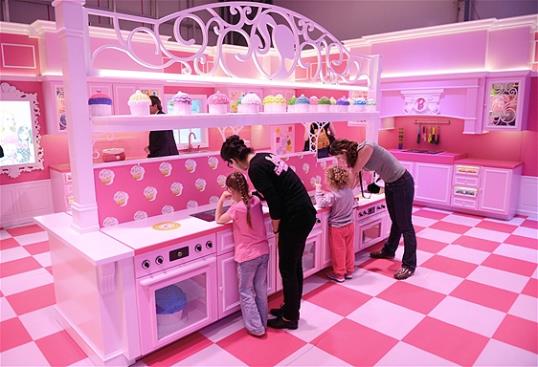 Photo: The pink kitchen is pictured with cupcakes in the Barbie Dreamhouse Experience near Alexanderplatz square in Berlin, Germany, Thursday May 16, 2013. (AP Photo/dpa, Jens Kalaene)