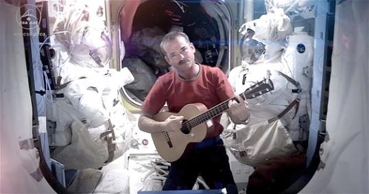 Photo: Astronaut Chris Hadfield recording the first music video from space Sunday May 12, 2013. The song was his cover version of David Bowie's Space Oddity. (AP Photo/NASA, Chris Hadfield)