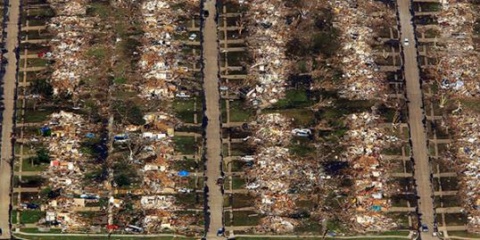 Photo: An aerial view of destroyed houses and buildings after a powerful tornado ripped through the area on May 21, 2013 in Moore, Oklahoma. (Photo by Benjamin Krain/Getty Images)