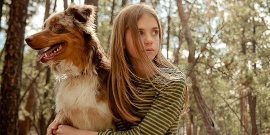 Photo: Young girl with dog / Joel Hawkins/Getty Images