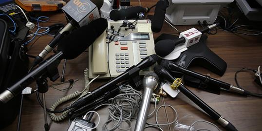 Photo: Reporters' microphones surround a speakerphone as a transgender woman speaks on it after she won a legal ruling at Hong Kong’s top court allowing her to marry, in Hong Kong //Vincent Yu/AP 