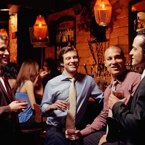 Men drinking and talking // PM Images, Getty Images