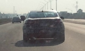 This camouflaged Ford Fusion was caught testing in metro Detroit. Photo by Autoweek.
