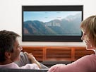 Image: Watching television (© image100/Corbis)