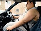Fat driver: Image: Smoking and driving (© Digital Vision/Getty Images)