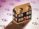 Image: Miniature home on sheet of percent signs © Comstock/Getty Images