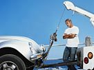 Image: Car being towed (© Digital Vision Ltd./SuperStock)