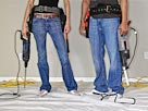 Image: Young man and woman holding power tools, low section (© Thomas Barwick/Photodisc/Getty Images)
