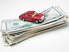 Image: Car on stack of money (© Dynamic Graphics/Jupiterimages)