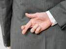 Image: Dishonest man (© Halfdark/fStop/Getty Images)