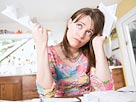 Image: Woman with paperwork (© Big Cheese Photo/Jupiterimages)
