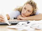 Image: Woman with paperwork (© Getty Images)