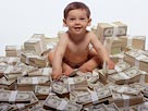 Image: Baby with money (© Creatas/Photolibrary)