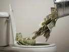 Image: Money into toilet (© RubberBall/SuperStock/SuperStock)