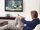 Image: Man changing TV channels with remote control (© Flying Colours/Digital Vision/Getty Images)