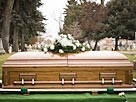 Image: Coffin at a cemetery (© Mike Kemp/the Agency Collection/Getty Images)