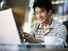 Image: Man with laptop (© Ken Seet/SuperStock)