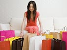 Image: Woman and shopping bags (© Image Source/Getty Images)