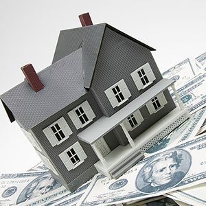 Image: House with bills (© Creatas/Photolibrary)