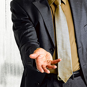 Image: Business man with open hand out © Le Club Symphonie, Cultura, Getty Images