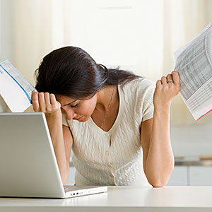 Image: Overwhelmed woman © Corbis