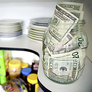 Image: U. S. banknotes on shelf in kitchen pantry © Supapixx, Alamy