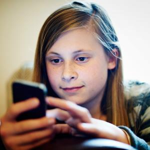 Smartphone on Young Girl Using Smartphone     Mike Harrington Lifesize Getty Images