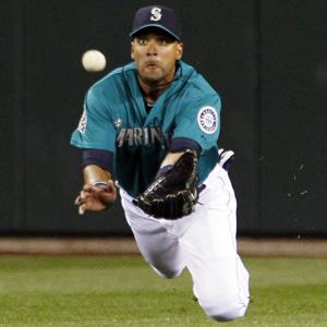 Seattle Mariners center fielder Franklin Gutierrez dives for a fly ball during a game on Sept. 7, 2012, in Seattle (© Elaine Thompson/AP Photo)