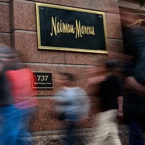 Pedestrians walk past a Neiman Marcus store on March 5, 2009 in Chicago, Ill. (© Scott Olson/Getty Images)