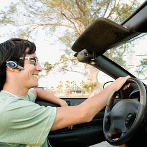 Man using hands-free phone (© Digital Vision Ltd./Getty Images)