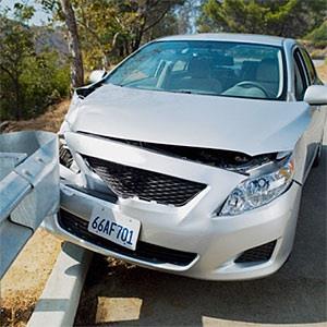 Car wrecked on road guardrail © NULL, OJO Images, Getty Images