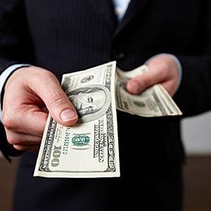Image: Businessman offering money © Andrea Bricco/Brand X Pictures/Getty Images