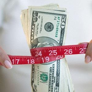 Image: Measuring Finances (© Corbis)