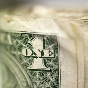 A bunch of dollar bills © Tetra Images, Getty Images