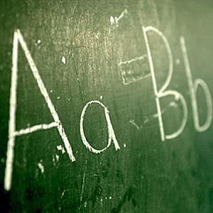 Image: A green chalkboard with the alphabet written on it © Ocean/Corbis /Corbis