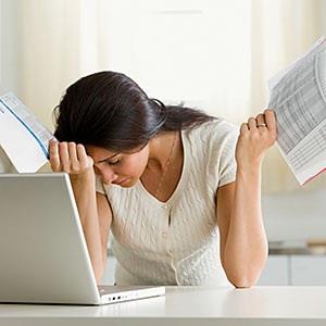 Image: Overwhelmed woman © Corbis