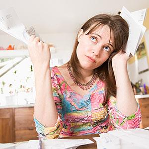 Woman with paperwork © Big Cheese Photo, Jupiterimages