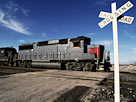 Image: Railroad Crossing with Train (Â© Edmond Van Hoorick/Photodisc/Getty Images)