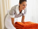 Image: Hotel maid (© Simon Jarratt/Corbis)