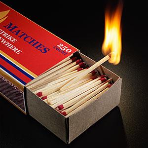 Image: Matchbox filled with matches, one matchstick burning Don Farrall/Photodisc/Getty Images