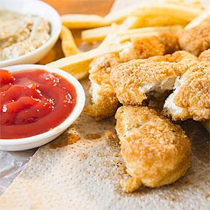 Close up of fried chicken finger copyright Alamy