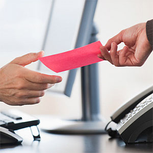 Business hand receiving a pink slip Tom Grill Photographer