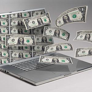 Image, Money and computer copyright Angel Muniz, Jupiterimages