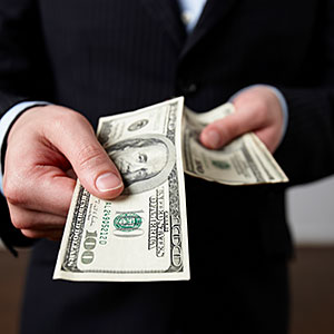 Businessman offering money Andrea Bricco Brand X Pictures Getty Images