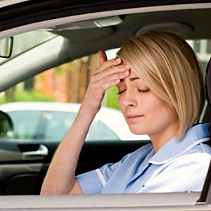 Woman in car with headache copyright Getty Images, Jupiter Images, Getty