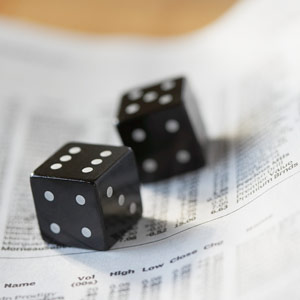 Dice on stock listings copyright Kate Kunz, Corbis