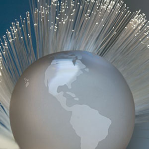 Silver globe with twinkling lights copyright Tetra Images, Getty Images